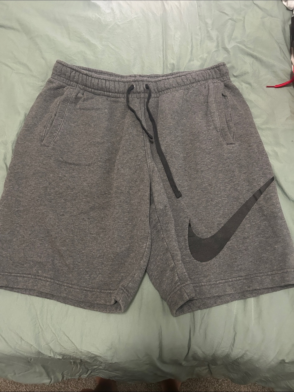 Nike Gray Athletic Shorts with Black Swoosh Logo